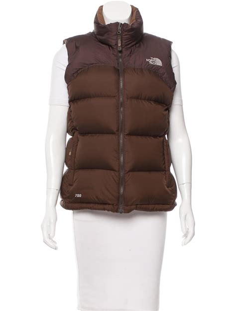 brown north face sleeveless puffer.